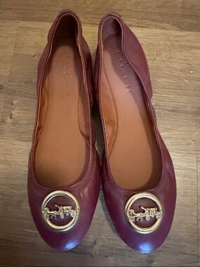 Coach Women's Burgundy Leather Flats with Gold Logo Medallions